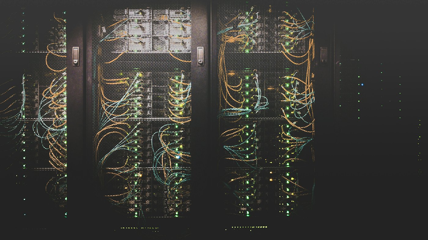 Server racks with network cabling and status lights